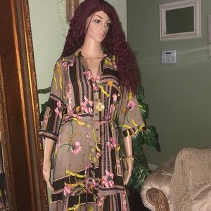 Long dress with floral patterns here and there.